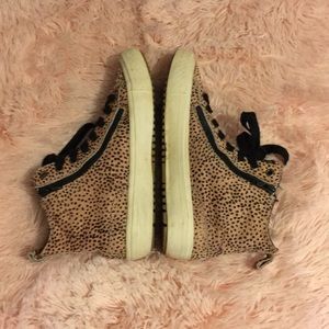 Furry pink and black sneakers